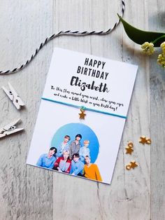 a birthday card with the words happy birthday elishah on it next to some scissors and flowers