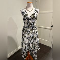 Bariii Nwt Size L Floral Sleeveless Belted Midi Dress Lined Scarf Like Cut Belted V Neck Layered Wrap Dress Msrp $89 Approximate Measurements L 47” (Longest Point) 36” (Shortest Point) Pit 22”-23” Waist 16” Polyester Machine Wash Belted Midi Dress, Floral Sleeveless, Wrap Dress, Colorful Dresses, Midi Dress, Black White, V Neck, Black And White, Bar