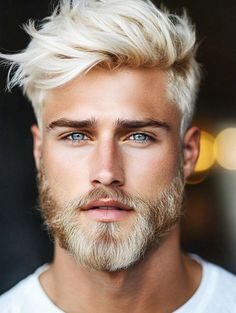 This ice blonde pixie cut with sharp, crisp lines gives a bold and polished look. The color stands out, making it perfect for lighter skin tones. The clean lines and structured top work well with square or oval faces, giving the style a balanced and defined look, perfect for someone who likes to maintain a sleek, modern appearance. Square Face Men, Short Hair With Beard, Platinum Blonde Pixie, Natural Brown Hair, Male Reference, Well Groomed Beard, Angular Face, Textured Pixie Cut, Men With Grey Hair