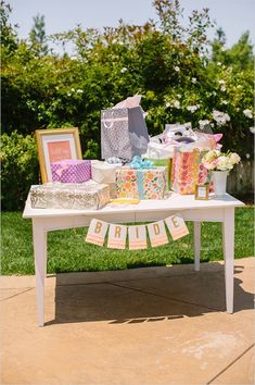 the backyard bridal shower table is set up outside