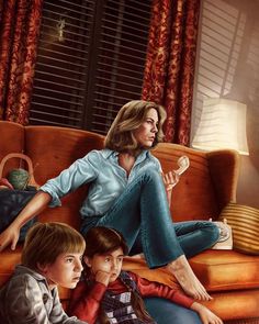 a woman sitting on top of a couch next to two children