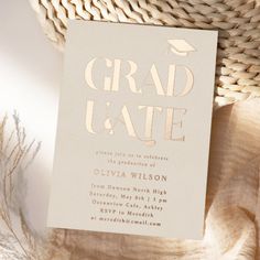 a graduation party card with the word grad u ate in gold foil on it