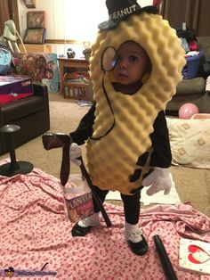 a young child dressed in a costume made to look like a peanut butter cracker