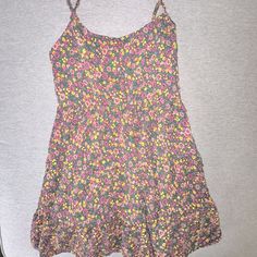 This Is A Floral Cami Dress That Is Perfect For The Spring/Summertime. It Has Never Been Worn Before And New With Tags. It Is A Mini Length, And Flowy At The Bottom. No Flaws! Patterned Summer Sundress For Day Out, Summer Patterned Sundress For Day Out, Casual Multicolor Sleeveless Floral Dress, Patterned Floral Print Dresses With Spaghetti Straps, Pink Floral Print Sundress For Beach, Pink Printed Sundress With Spaghetti Straps, Summer Floral Print Patterned Sundress, Summer Patterned Sundress With Floral Print, Pink Sundress With Floral Print And Spaghetti Straps