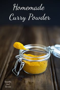 homemade curry powder in a glass jar on a wooden table with the words, homemade curry powder