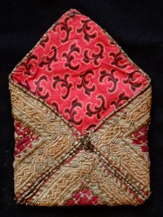 This is a beautiful metallic embroidered Uzbek pouch.  The inner lining is in a cotton block printed material.  The workmanship is exquisite.    -Metallic embroidery-Cotton block printed lining Traditional Red Pouch, Traditional Ceremonial Bags With Gold Embroidery, Traditional Gold Embroidered Ceremonial Bags, Traditional Embroidered Pouch For Festivals, Traditional Pouch With Intricate Embroidery For Festivals, Traditional Embroidered Pouch For Festive Occasions, Traditional Festival Pouch With Intricate Embroidery, Traditional Pouch With Gold Embroidery, Traditional Pouch With Gold Embroidery For Festive Occasions