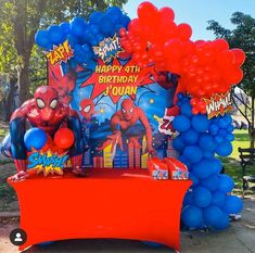 the balloon arch is decorated with balloons and spiderman decorations for a birthday party or baby shower