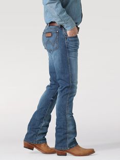 Men's Wrangler 77MWZ Llano (112317887) Retro® Slim Fit Bootcut Jean Since 1947, Wrangler® jeans have been a cowboy-approved wardrobe staple. Inspired by their Western heritage, these Wrangler® Retro® jeans combine our most iconic features with contemporary fits and washes. This updated classic features the same worn leather patch with our rope logo, 'W' stitching on the back pockets, and five-pocket styling. These men's slim bootcut jeans feature a streamlined silhouette through the seat, thigh, and knee, but the leg widens from the knee downward, which is good news for boots. When it comes to finding the best bootcut jeans for men, your search ends here. Fit: Slim Rise: Low Front Rise: 10 3/8" Leg: Bootcut Leg Opening: 18" Front Closure: Zip-Fly with button closure 12.25 Oz. Stretch Denim Best Bootcut Jeans, Rodeo Fits, Carhartt Work Pants, Slim Bootcut Jeans, Guys Fashion, Western Clothes, Rolled Up Jeans, Man Dressing Style, Work Pants Women