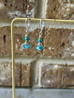 the earrings are made with glass beads