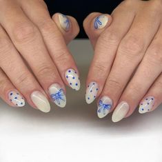 These nails feature a delicate milky white base with charming blue bows and polka dots, reminiscent of a breezy summer day.  🌸Click on the image to shop our trending Korean Gel Polish this season.  🌸Credit: bybrooklynn on Instagram 🌸summer nails, bow nails, polka dot nails, white nails, Korean gel polish, trendy nails, summer manicure, nail art, cute nails, elegant nails, summer nail trends, nail fashion, stylish nails, summer nail inspiration, gel polish nails, summer nail art, Korean nail trends, blue and white nails, summer nail ideas, nail designs 2024. New Trendy Nail Designs, Nail Inspiration Blue And White, Nail Ideas Trendy 2024, Boston Nails Designs, Gel X Nail Designs Blue, Creative Nail Art Ideas, Cute Polka Dot Nails, Milky White Nails With Blue Design, Blue Nails White Tips