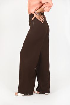 BLUEBIRD WOMEN'S DARK BROWN CASUAL BELL BOTTOM TROUSERS   The Bluebird Women's Dark Brown Casual Bell Bottom Trousers offer a stylish blend of comfort and fashion. Perfect for casual outings or relaxed weekends, these trousers feature a flattering fit that elongates the legs while providing all-day comfort. The rich dark brown color complements various tops, making them a versatile addition to your wardrobe.  Features  Stylish bell bottom design  Comfortable fit for all-day wear  Versatile dark brown color  Ideal for casual and semi-formal occasions   Specifications  Brand: Bluebird  Color: Dark Brown  Available Sizes: S, M, L, XL  Style: Casual Bell Bottom   Material & Care  Material: Cotton Blend  Care Instructions: Machine wash cold, tumble dry low, iron if needed.    Legal Disclaimer: Elegant Full-length Brown Bottoms, Cheap Full-length Brown Bottoms, Brown Mid-rise Bottoms, Brown Full-length Solid Color Bottoms, Stretch Brown Full-length Dress Pants, Brown Wide-leg Elastane Pants, Bell Bottom Trousers, Trouser Outfits, Dark Brown Color