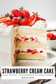 a close up of a cake with strawberries on top and the words strawberry cream cake