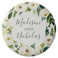 a white and green floral wedding coaster with the words madison and nicholas written on it