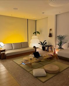 a living room with two couches and a coffee table in the middle of it