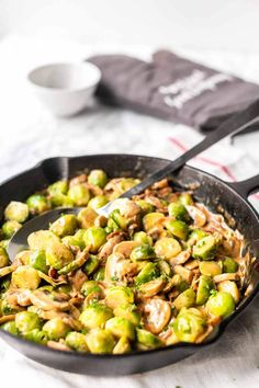 brussel sprouts and mushrooms in a skillet with text overlay