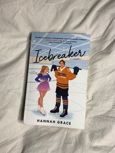 the book icebreakerer by hannah grace is laying on a bed with white sheets