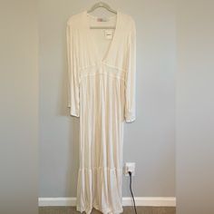 Free People Beach Dress Color Is Cream With Heathered Texture Never Worn With Tags Size Small 65% Polyester 35% Rayon Runs Long Deep V Neck Wide Sleeves Very Boho Chic! Spring V-neck Beach Dress, Long Sleeve Maxi Dress For Beach Season Brunch, Long Sleeve Maxi Dress For Brunch Beach Season, White V-neck Maxi Dress For Loungewear, White Flowy Dress For Loungewear, Long Beach Dress For Spring Brunch, White Flowy Maxi Dress For Loungewear, Chic V-neck Beach Dress For Loungewear, Chic V-neck Beach Dress