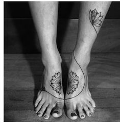 two people with tattoos on their feet and one has a flower tattoo on the foot