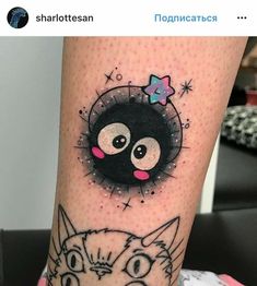 a cat and kitten's face on the leg, with an eyeball in the middle