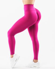 HIGHLIGHTS. High-waisted legging 3-tiered tapered waistband. Seamless, knit fabric. No front seam. Back scrunch seam detail to enhance curves. Leg and glute contouring panels. ForeverKnit core logo on waistband FIT SUGGESTION. This item runs true to Alphalete’s standard seamless fit.. If you are between sizes, we recommend sizing up.. Model is 5’4”/162.5cm, wearing a size XS with a 26”/66cm waist and 39.5”/100.3cm hips. MATERIALS AND WASHING DIRECTIONS. 51% Polyamide, 38% Polyester, 11% Elastane Tight Seamless Sportswear Bottoms, Fitted Seamless Sports Leggings, High Waist Seamless Tights For Sports, High Waist Seamless Sports Tights, Seamless High Waist Leggings For Sports, Training Tights With Wide Waistband, Fitted Bottoms With Contoured Waistband For Light Exercise, Seamless Leggings For Training, Seamless Training Leggings