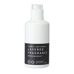 a bottle of white liquid on a white background