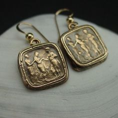 Handmade reproduction of intaglio earrings representing this great Odyssey scene of Odysseus (Ulysses in Latin) returning to his queen Penelope.The cameo represents Queen of Ithaca, Penelope, being led in secret by her lady in waiting to her husband, Odysseus, who went missing during the Trojan War.The Odyssey is a Greek epic poem traditionally attributed to Homer, describing the travels of Odysseus during his ten years of wandering after the fall of Troy. He eventually returned home to Ithaca a Odysseus And Penelope, His Queen, After The Fall, Lady In Waiting, The Odyssey, Antique Earrings, Ancient Rome, Rome, Dangle Drop Earrings