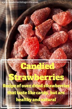 candied strawberries in a bowl with text overlay that reads, candied strawberries recipe oven dried strawberrys that taste like candy but are healthy and natural