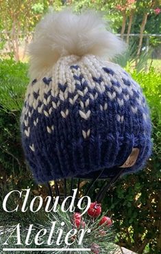 "This beanie is hand knit with a chunky premium quality acrylic yarn.  It is warm and is sure to keep out the cold.  Size M  measures approximately 8\" high(crown to brim) and 20\" in circumference-should fit most average teen/adults (21-22\") Size L   measures approximately 9\" high (crown to brim) and 22\" in circumference-should fit larger adult (22-24\") Detachable faux fur pom should be removed before  laundering the beanie.  Hand wash and lay out flat to dry will extend the life of the beanie. Use a hair dryer to fluff out the pom if it should get wet." Handmade Blue Beanie For Winter, Handmade Cozy White Beanie, Cozy Handmade White Beanie, Hand Knitted White Yarn Beanie, Handmade White Hats For Cold Weather, Cozy White Handmade Hat, White Hand Knitted Beanie Bonnet, White Chunky Knit Beanie Hat, White Knitted Hats For Cold Weather