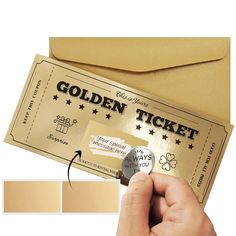 a ticket is being held up by a person's hand, with the word golden ticket on it