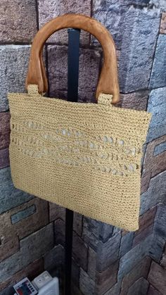 Handcrafted raffia summer portfolio will complement your clothes and add elegance to your elegance. Vacation Knitted Straw Tote Bag, Knitted Straw Tote Bag For Vacation, Elegant Vacation Crochet Bag With Open Weave, Elegant Open Weave Crochet Bag For Vacation, Rectangular Knitted Straw Bag For Summer, Summer Rectangular Knitted Straw Bag, Elegant Crochet Bag With Open Weave For Beach, Rectangular Crochet Bag For Summer, Elegant Jute Crochet Bag