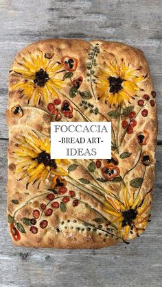 a piece of bread with flowers painted on it that says focacacia bread art ideas