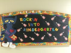 a bulletin board with an image of a black cat playing the guitar and singing rock'n'roll