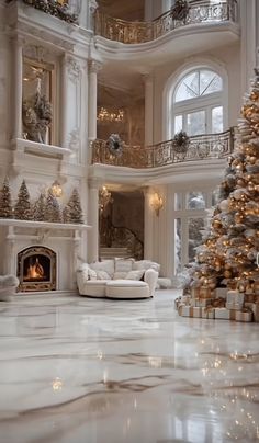 a large living room with a christmas tree in the center and lots of decorations on the walls