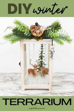 an image of a christmas decoration with deer and pine trees in it, on top of a table