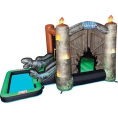 an inflatable bouncer with a dinosaur and fire hydrant