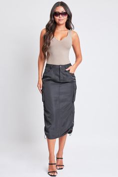 Take your style to the max with our Women’s Maxi Cargo Skirt. This trendy nylon skirt hits above the ankle for a maxi silhouette and features five-pocket styling with faux flap pockets in the back, snap button cargo pockets at the side, and a slit hem at the back for ease of movement. Detailed with bungee ties at the hem for optional ruching, belt loops, and a front zip fly with a snap button closure. Style with a fitted top and sneakers for an on-trend streetwear look we are loving right now! P Maxi Cargo Skirt, Nylon Skirt, Ymi Jeans, Black 13, Cargo Skirt, Fitted Top, Women Maxi, Taupe Color, Flap Pocket