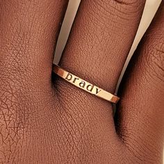 This personalized stacking ring features a unique and stylish handwriting font or serif font, adding a personal touch to your jewelry collection. Handmade with care, each ring is crafted with 14k gold filled or fine silver materials for a luxurious look and feel. Make a statement with this modern and customizable piece. Adjustable Stackable Initial Ring, Everyday Gold Hand Stamped Stackable Rings, Everyday Custom Name Gold Ring, Everyday Gold Ring With Custom Name, Everyday Gold Rings With Custom Name, Minimalist Gold Engraved Ring With Custom Name, Gold Minimalist Ring With Custom Name Engraving, Hand Stamped 14k Gold Engraved Ring, Everyday Stackable Rings With Custom Name