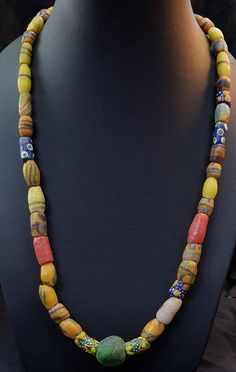 Its Beautiful Lovely Color of Ancient African Beads Wonderful Old Necklace it used to be called tribal Beads like in past they used instead of money Length 52cm Traditional Multicolor Single Strand Beads, Traditional Yellow Gemstone Beads Necklace, Bohemian Yellow Single Strand Beaded Necklace, Yellow Bohemian Single Strand Beaded Necklace, Traditional Single Strand Necklaces For Festivals, Traditional Single Strand Festival Jewelry, Traditional Single Strand Jewelry For Festival, Artisan Necklaces With Large Beads For Healing, Amulet Necklaces With Large Oval Beads