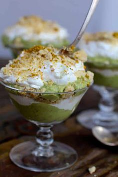 two dessert dishes with whipped cream and green toppings