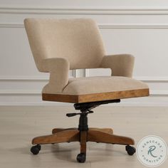 an office chair sitting on top of a hard wood floor next to a white wall