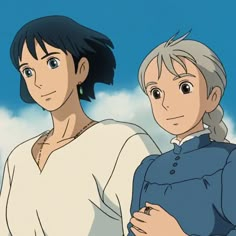 two people standing next to each other with clouds in the background and one person looking at the camera