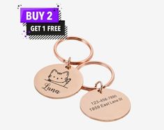 two personalized key chains with a cat on one side and the words, buy 2 get 1 free