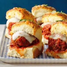 small sandwiches with meat sauce and cheese on a plate