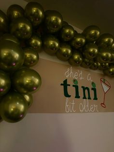 there is a sign that says it's a tini kit older on the wall