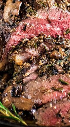 steak with mushrooms and herbs in a skillet