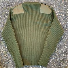 "Olive green DSCP Valor military issue sweater. Size 44 men's. Excellent condition, almost unworn. 100% wool, thick, soft and stretchy. Clean and warm, classic style and made with quality and durability in The USA. - Model size men's large - Approximate measurements when laid flat: 19\" armpit to armpit 19\" shoulder to shoulder 28\" sleeve, 28\" back of collar to hem" Military Style Green Winter Tops, Dirty Green Sweater, Green Knitted Sweater Mens, Mens Olive Green Sweater, Cheap Green Men's Sweater, Military Style Green Hunting Outerwear, Pullover Sweater Men, Pullover Men, Medium Blue