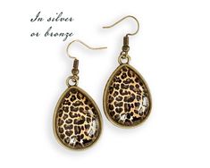 These Leopard earrings are crafted one at a time in my home studio. These African earrings are composed of a quality printed image and protected with a pure, crystal clear glass cabochon that protects the printed art underneath. Each jewelry will come in a lovely little gift bag ready for gift-giving. A perfect jewelry gift for cat lovers. More Leopard jewelry: https://www.etsy.com/shop/MeGustaMuchoShop?ref=seller-platform-mcnav&search_query=leopard SHIPPING: Please, note that the standard s Leopard Print Drop Earrings Gift, Leopard Print Earrings For Pierced Ears As Gift, Leopard Print Earrings For Gift, Leopard Jewelry, Leopard Earrings, Animal Print Earrings, Teardrop Jewelry, African Earrings, Unique Gifts For Mom