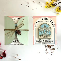 two save the date cards with twine tied to each other and some dried flowers