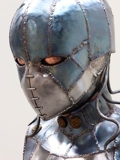 a close up of a person wearing a metal suit