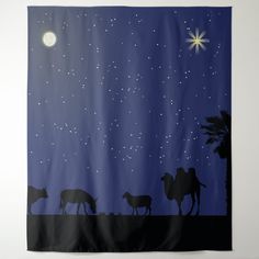 the silhouettes of three animals are standing in front of a night sky with stars